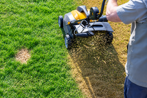 Lawn core aeration machine in action on a yard in Montgomery County, MD by Anytyme Outdoor Services, landscaping tips Montgomery County