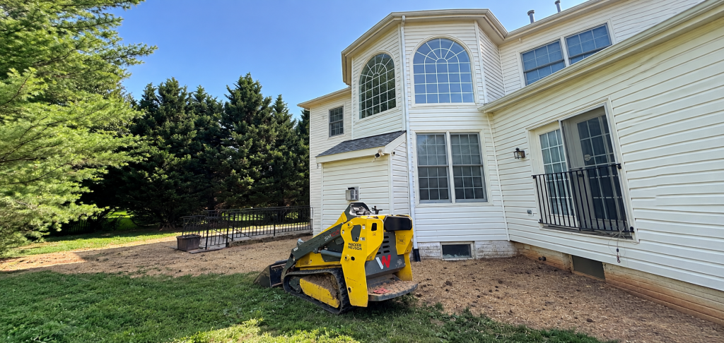 Two-story residential home with a manicured front lawn and landscaping in Montgomery County, MD by Anytyme Outdoor Services, landscaping tips Montgomery County